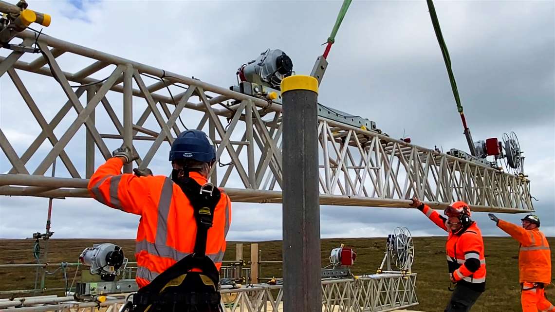 Teams lowering winch system into place at Cowburn Tunnel