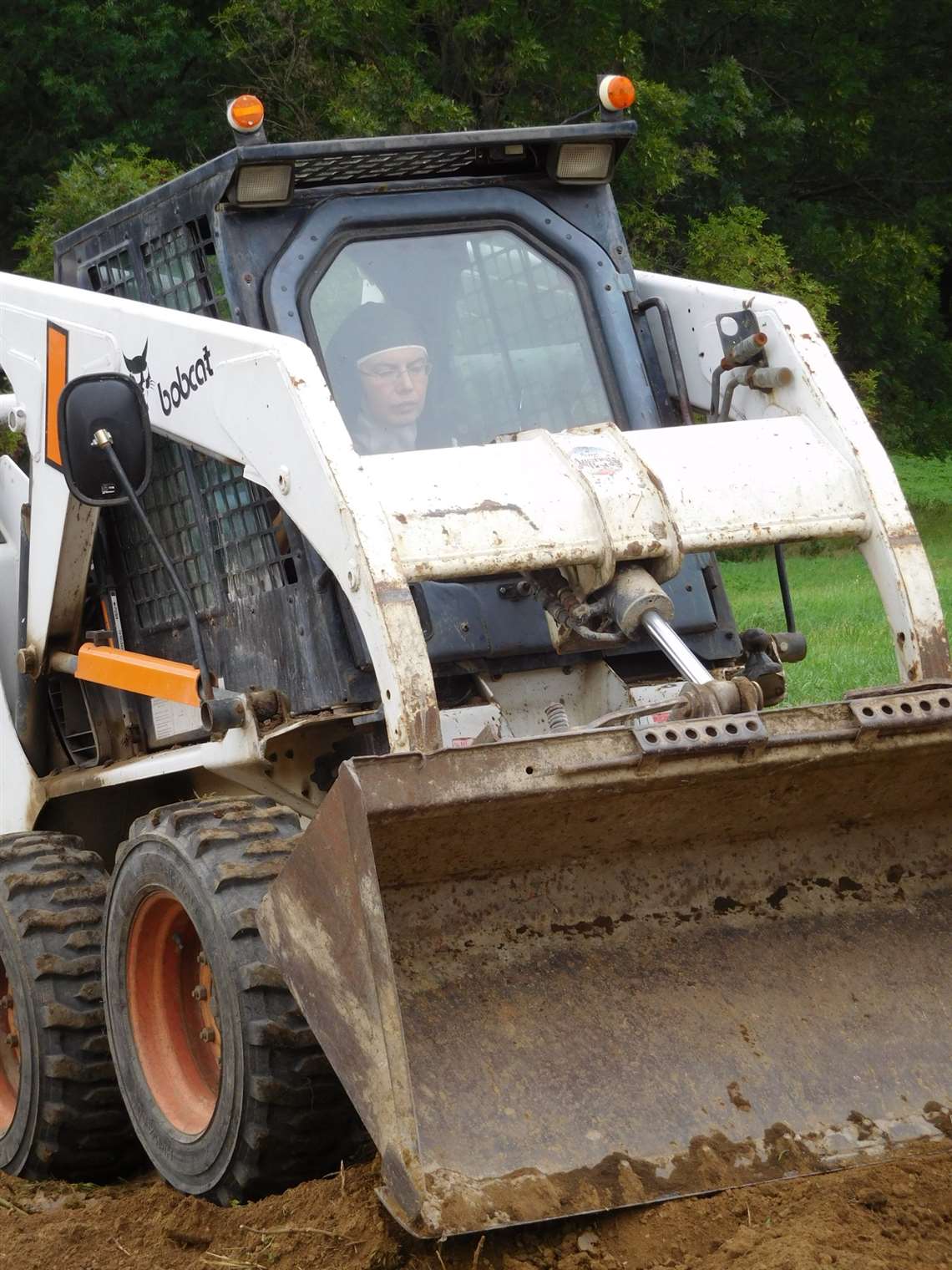 Sister Sára also operates the Bobcat loader