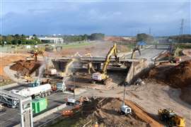 Excavators demolishing the M42 two-span bridge