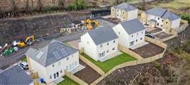 Houses under construction in a rural area of the UK.