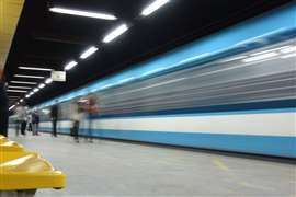 Cairo metro station with motion blurred train and passengers - Cairo, Egypt