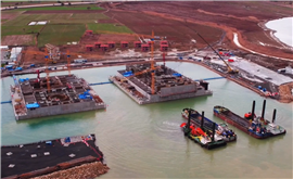 The two bridge caissons are floated in dry dock, ready for towing out to sea.