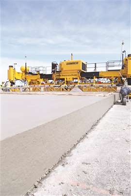 Gomaco GP4 four-track slipform paver at work on an airport runway 