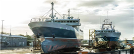 Ships in dry dock at a facility in Africa.