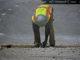 Construction crews working on removing concrete along one of the bridges being rehabilitated as part of the three-year-long project along I-55 between I-44 in the city of St. Louis and Lindbergh