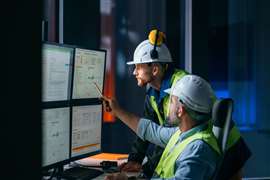 Construction workers on computer (Image: Adobe Stock)