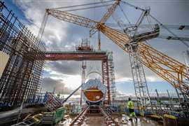 Installation of the first of two reactor pressure vessels at Hinkley Point C nuclear power plant in Somerset, England.