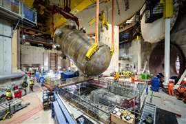 Installation of the first of two reactor pressure vessels at Hinkley Point C nuclear power plant in Somerset, England.