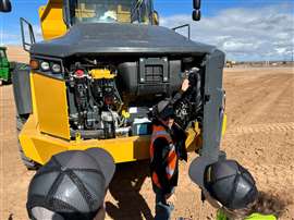 Kasey Kelly shows John Deere 460 P-Tier ADT engine (Image: Mitchell Keller)