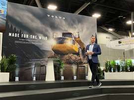 Volvo CE's Scott Young addresses press at the company's WOA booth(Image: Mitchell Keller)