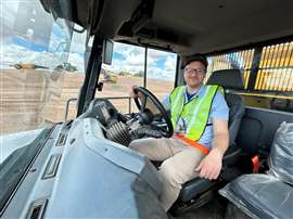 Mitchell Keller behind the wheel of a John Deere ADT (Image taken by Kasey Kelly)