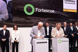 The LIebherr/Fortescue contract signed at MINExpo (Image: Liebherr)