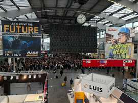 Visitors queue up ahead of the doors opening at the Bauma 2025 exhibition in Munich, Germany