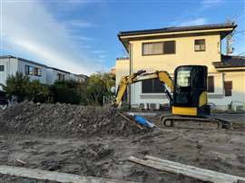 An excavator on a residential construction site in Nagoya, Japan