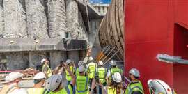 Construction workers film the start-up of the tunnel boring machine “Karpatka” ahead of the construction of a 2km-long double tunnel on the future S19 highway between Rzeszów Południe and Babica, Poland