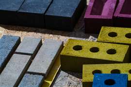 The K-BRIQ is not kiln-fired and is manufactured through a process that results in 95% less embodied carbon compared to traditional clay bricks