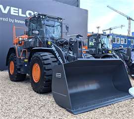 Develon DL 320 loader with new waste and recyclying guard kit Image: Develon