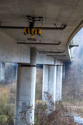 Aithon Robotics' drone uses high-capacity suction cups to latch onto hard-to-reach areas of structures (Image courtesy of Aithon Robotics)