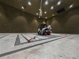 A skid steer loader sits inside the anechoic chamber at the heart of Bobcat’s Innovation Centre in Dobříš, Czech Republic. Construction Briefing had the chance to take a look at the huge room, which is filled with sound-absorbing panels. The chamber provides a controlled environment in which Bobcat use instruments to evaluate the noise and vibration levels emitted by its machines and components. (Image: Neil Gerrard/KHL Group)