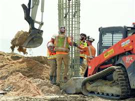 Crew members work a long 36-foot-long fiberglass cage into the hole made by an auger cast drill that's already full of concrete, to create a concrete pile. The work took place on the seawall construction site on A1A near Briggs Dr in Ormond-By-The-Sea, Florida, USA. Florida Department of Transportation engineers are overseeing construction of two 1.3-mile-long seawalls at Ormond-By-The-Sea and Flagler Beach at a cost of $117 million. The seawalls are designed to protect the A1A from hurricanes after suffering repeated damage. (Image: Credit USA Today Network via Reuters Connect)