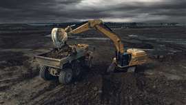 A Cat 374 loading an ADT with an XMOR bucket (Image courtesy of AMI Attachments)
