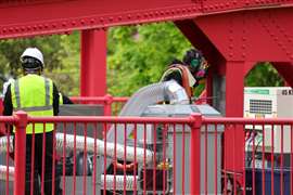 The process speeds up powdered steel in compressed gas and then the technician uses an applicator to spray the steel onto the beam. Repeated sprays create multiple layers, restoring thickness and other structural properties. (Image: MIT)