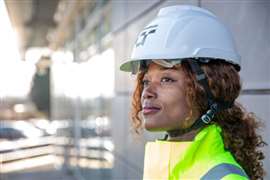 An AtkinsRéalis employee wearing its newly redesigned hard hat