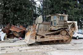 An armoured Caterpillar bulldozer stands on a street during an Israeli raid at Tulkarm, in the Israeli-occupied West Bank, 18 February, 2024. (Image: Reuters/Raneen Sawafta/File Photo)