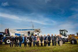 Liebherr and local dignitaries with shovels