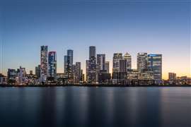 London's Canary Wharf at night (Image: Ross via AdobeStock - stock.adobe.com)