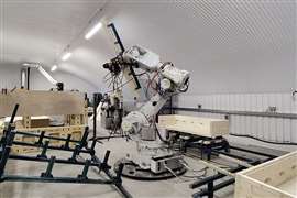 Un'azienda di robotica collabora allo sviluppo di case in legno