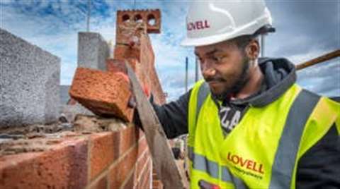 Site worker laying bricks