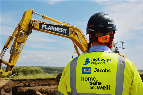 A worker on site with an excavator