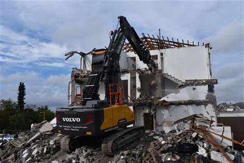 Scholko's new Volvo EC220E with lift cab demolishing a building