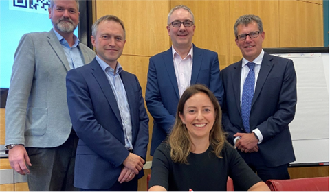 National Highways Director Sandie Forte-Gill (seated) and (left to right) Richard French of Kier, Simon Ellison of Costain, Phil Clifton of Balfour Beatty, and Darren James, Keltbray CEO. 