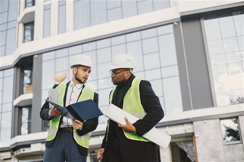 Two construction workers on a construction site