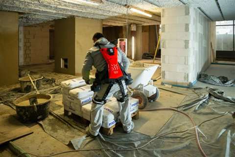 A worker trials German Bionics Cray X exoskeleton on a construction site.