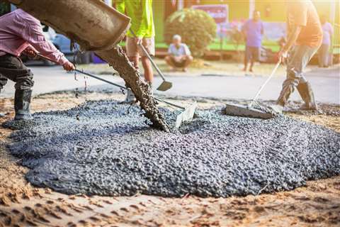 concrete being poured on a construction site