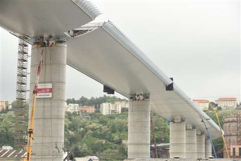 Final span is lowered into position on the new Genoa bridge