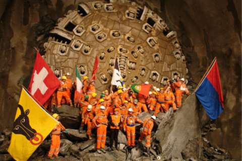 Workers celebrate following the breakthrough of the Gotthard tunnel in Switzerland. At 57 km it is t