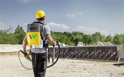 An operator using the Wacker Neuson backpack internal vibrator