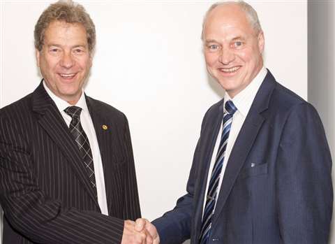 New CEA president Rory Keogh (left) shakes hand of outgoing president Nigel Baseley (right)
