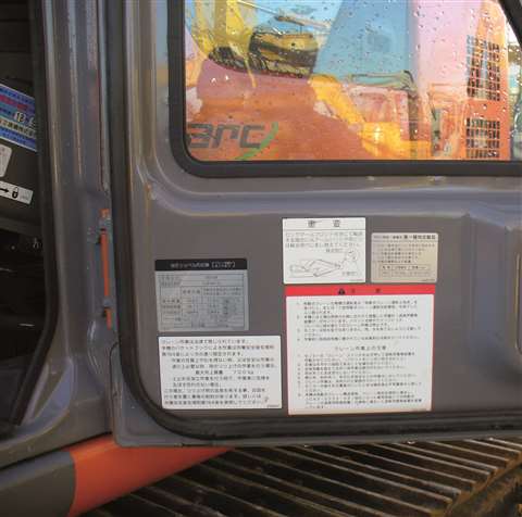 Decals and risk warnings in non-European languages.