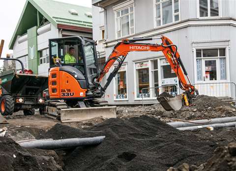 The new Hitachi zero-tail swing mini excavator laying new pipes and cables in Hverfisgata, Reykjavík