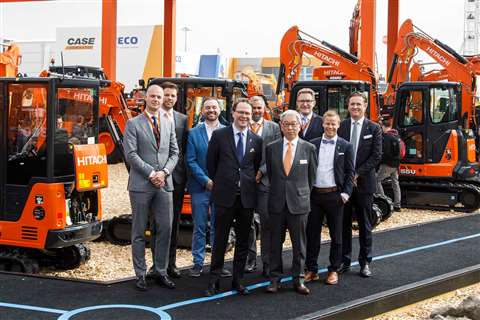 Hitach and ABAX teams at signing of deal